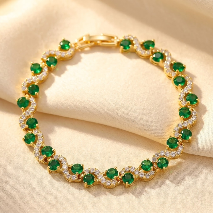 Gold Halo Bracelet with Emerald Centerpiece