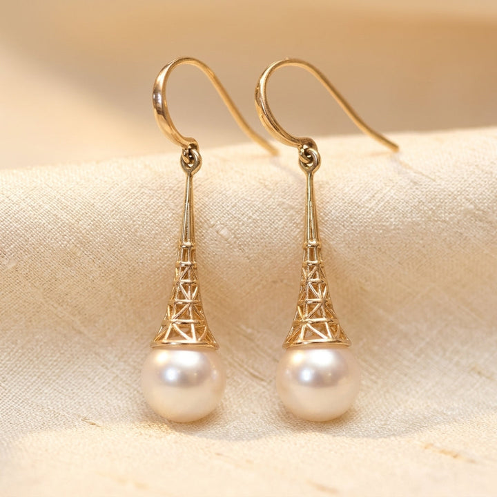 Sophisticated Pearl Dangle Earrings Featuring Intricate Gold Filigree Design
