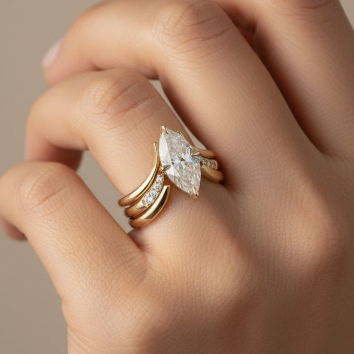Crown-Inspired Golden Ring with Flowing Drapes