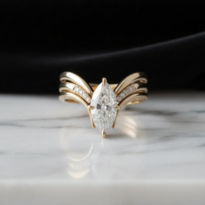 Crown-Inspired Golden Ring with Flowing Drapes