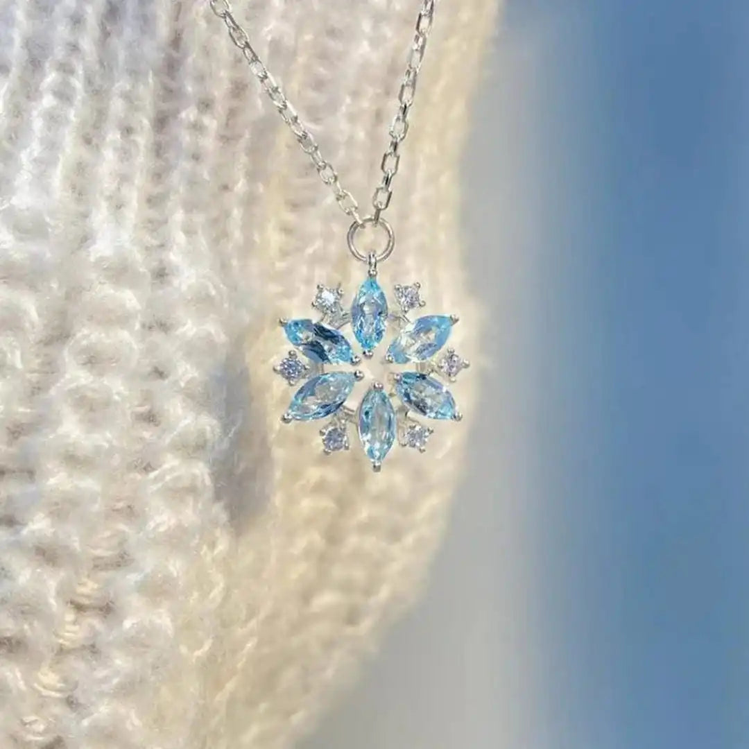 White Gold Floral Pendant Necklace Featuring Blue Snowflake Detail