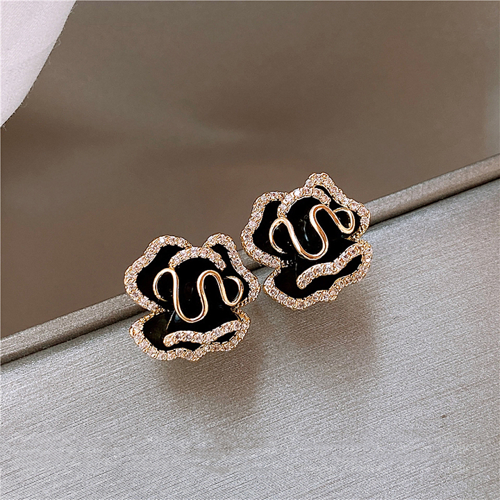Elegant Black Lotus Earrings with Gold Accents