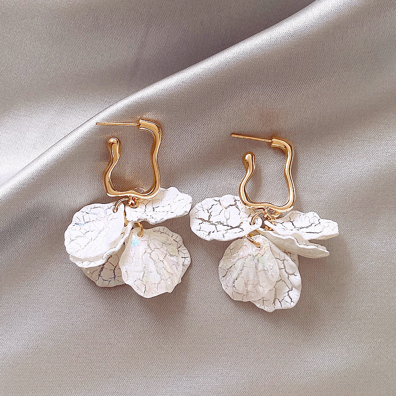 Elegant Earrings Adorned with White Floral Details