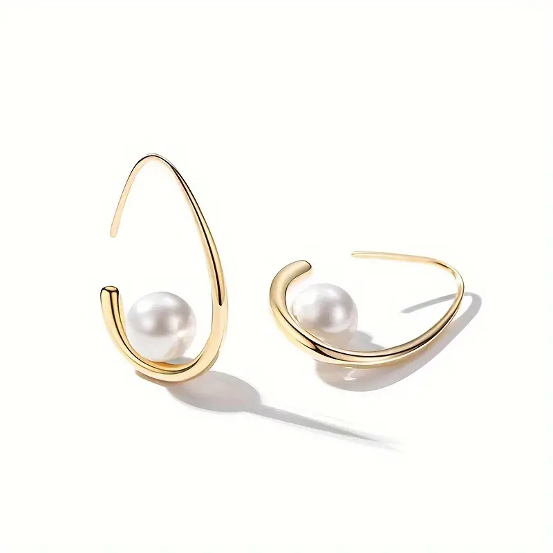 Elegant Gold Earrings Featuring Pearl Details