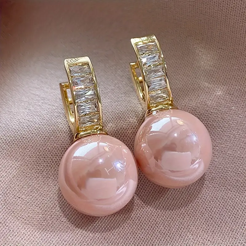 Rose Gold Earrings Featuring Pink Zirconia Pearls